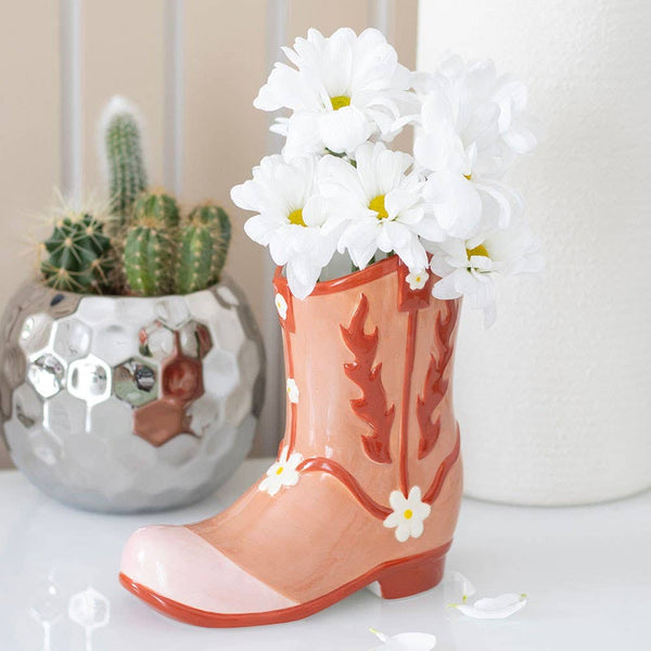 Jarrón con forma de bota de vaquero rosa