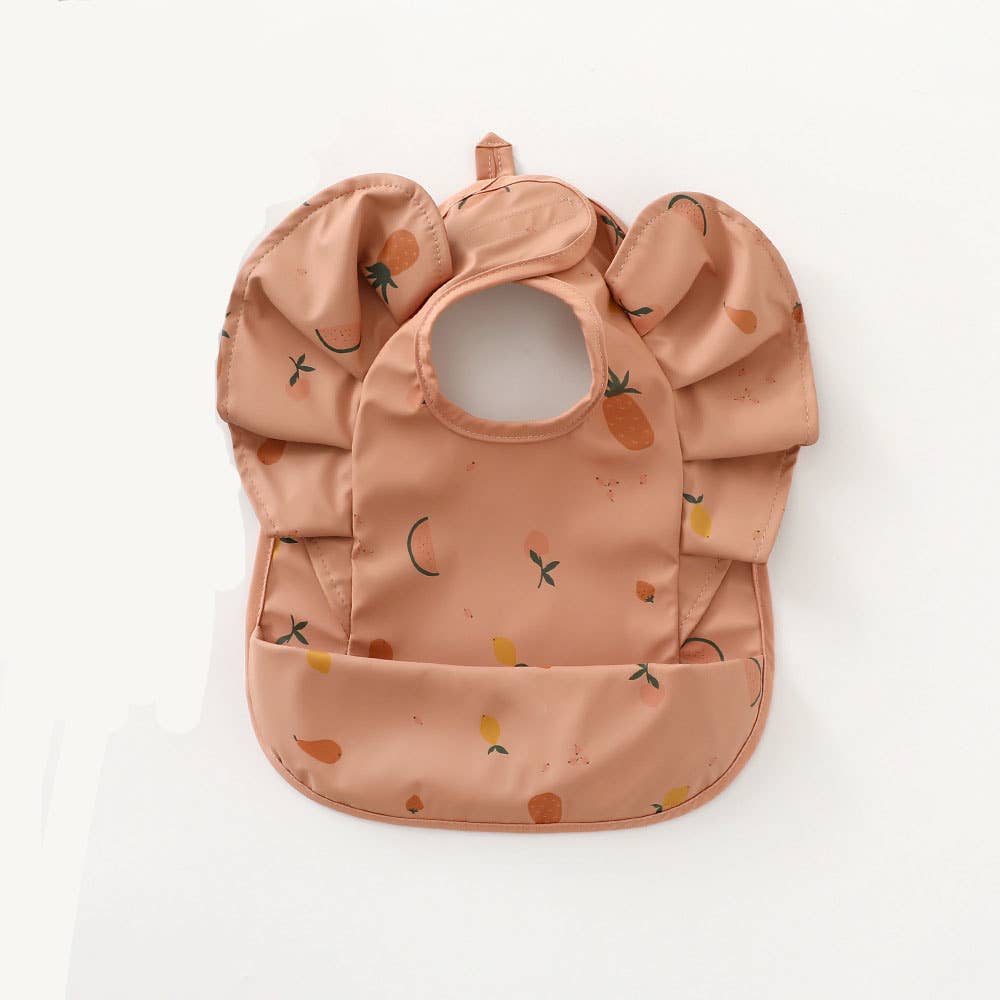 Pink ruffled waterproof bib with fruit print
