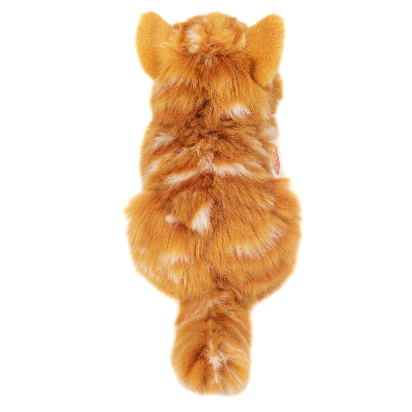 Gato pelirrojo de peluche acostado