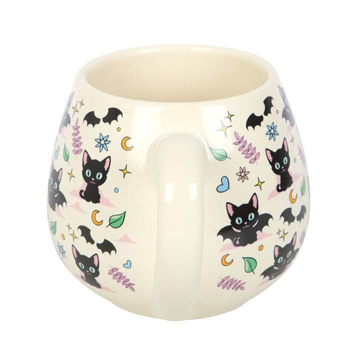 Round ceramic mug with cute and mysterious black cat designs
