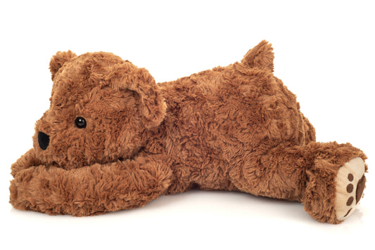 Urso de peluche castanho reclinado