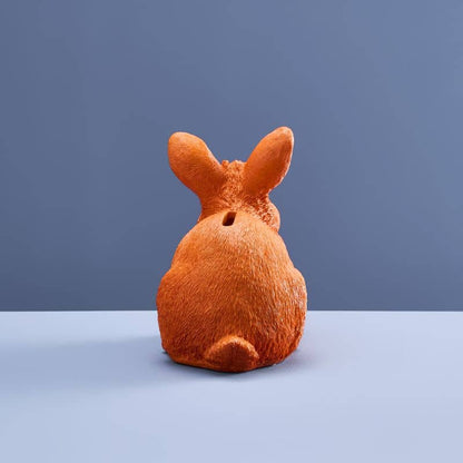Thrifty rabbit, orange polyurethane resin, 21 x 11 x 16 cm