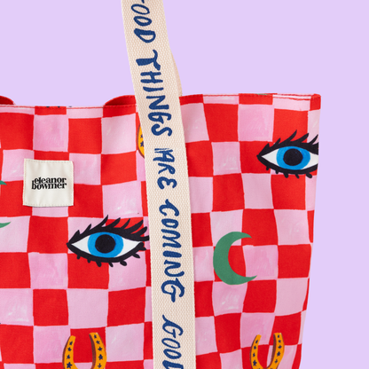 bolso de mano con icono de verificación