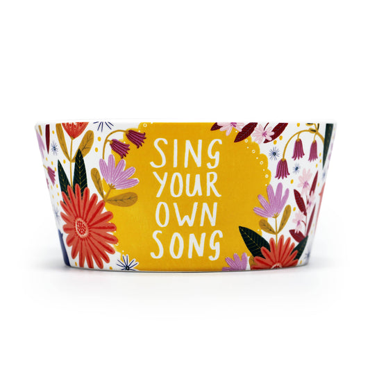 Cuenco de cerámica con diseño floral, mensaje positivo y edificante.