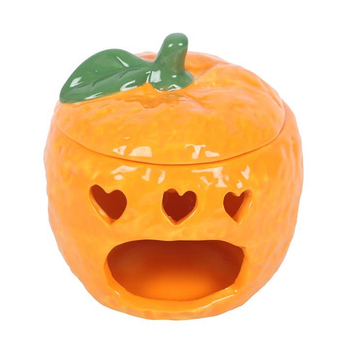 Oil burner shaped like a freshly picked orange