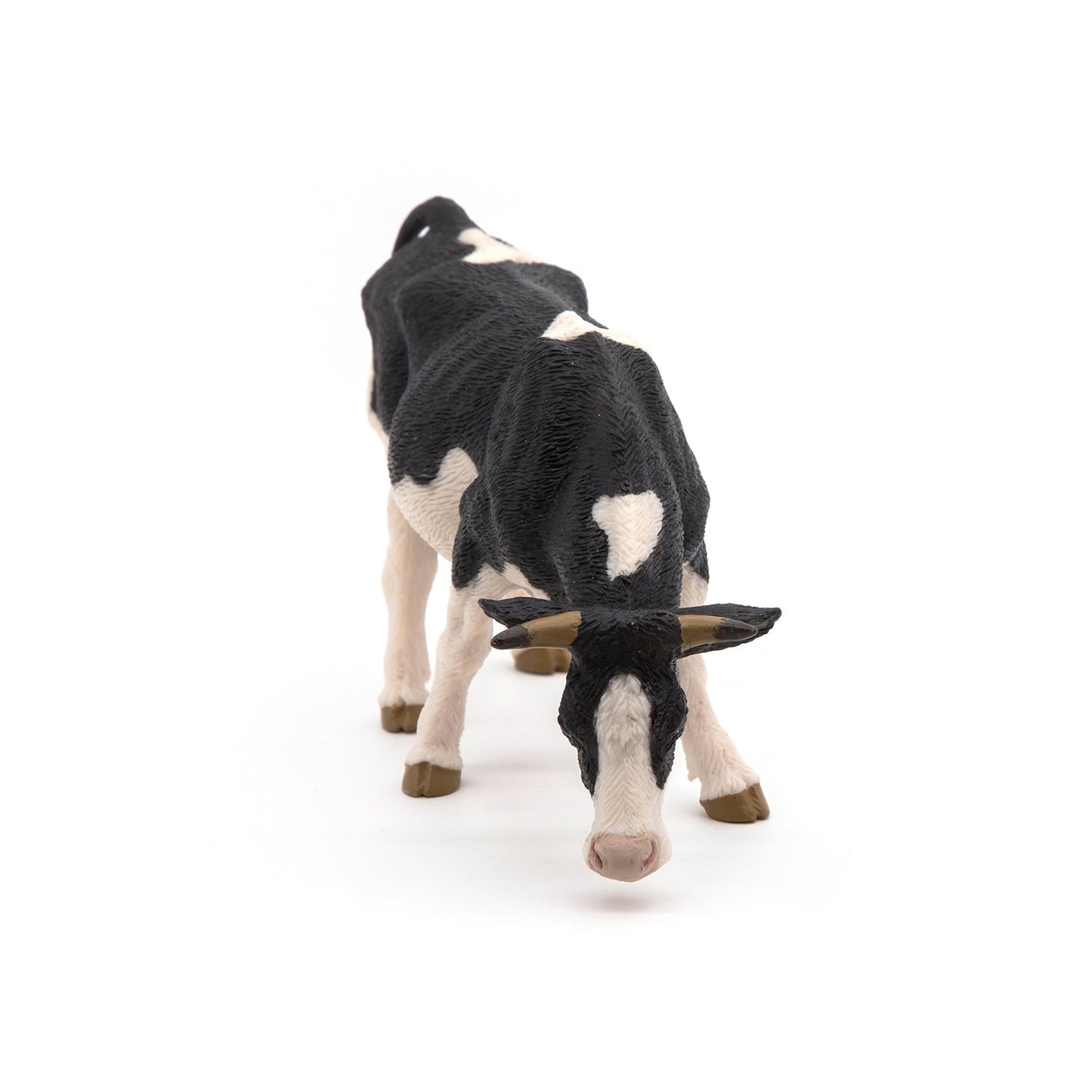 Figurine Vache noire et blanche broutant