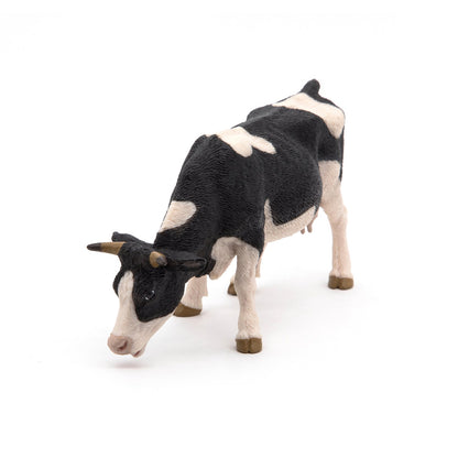 Figurine Vache noire et blanche broutant