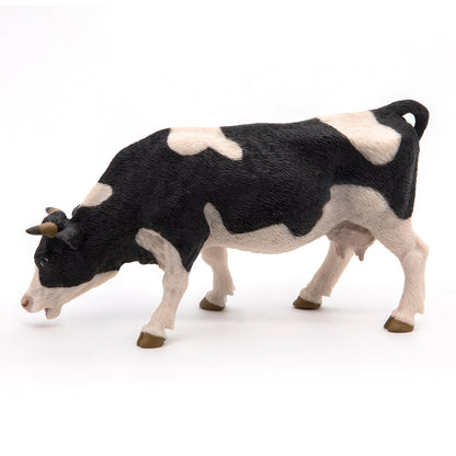 Figurine Vache noire et blanche broutant