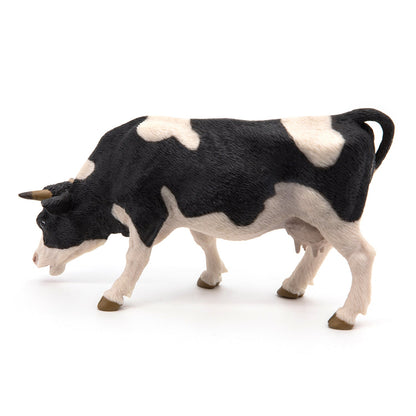 Figurine Vache noire et blanche broutant
