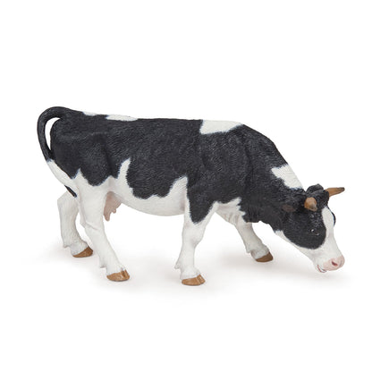 Figurine Vache noire et blanche broutant