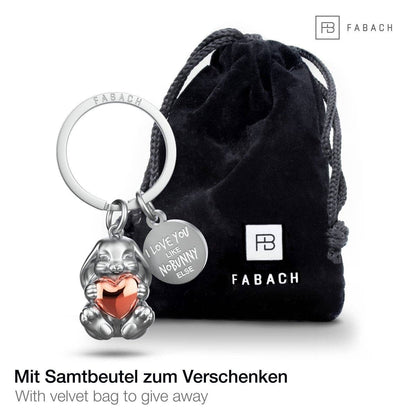Llavero con forma de conejito grabado con la frase "Te quiero como a ningún otro conejito". Lindo amuleto de la suerte con forma de corazón.