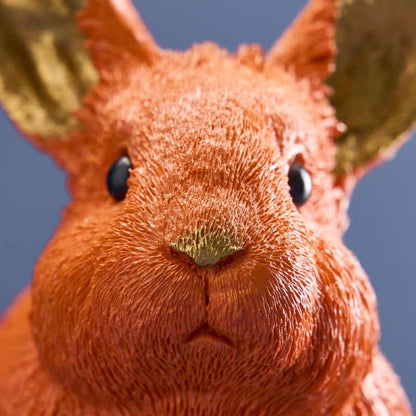 Thrifty rabbit, orange polyurethane resin, 21 x 11 x 16 cm