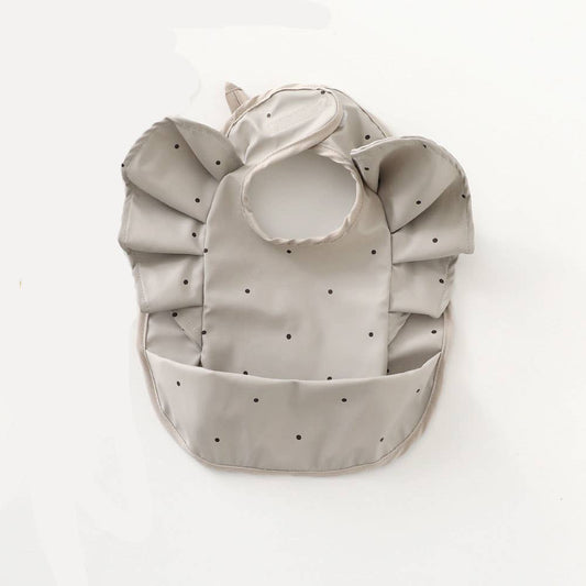 Grey waterproof frilly bib with polka dots