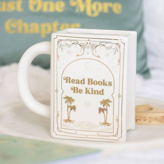 Lee libros, sé amable. Taza blanca con forma de libro.