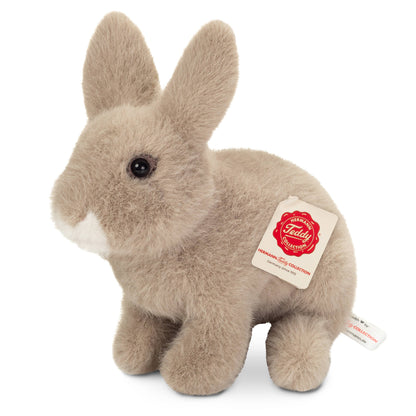 Conejo de peluche gris sentado