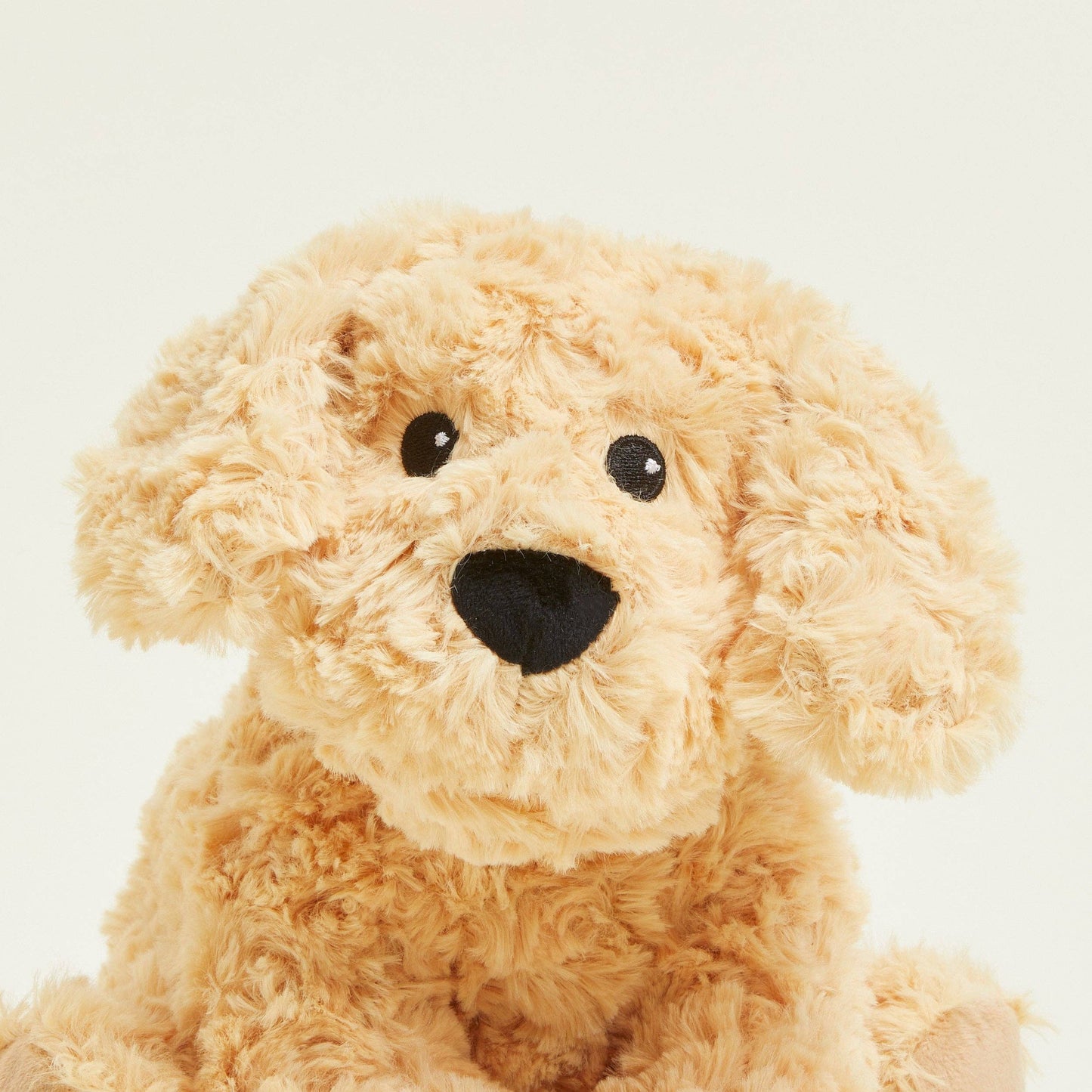 Bolsa de agua caliente de peluche de perro rizado Warmies