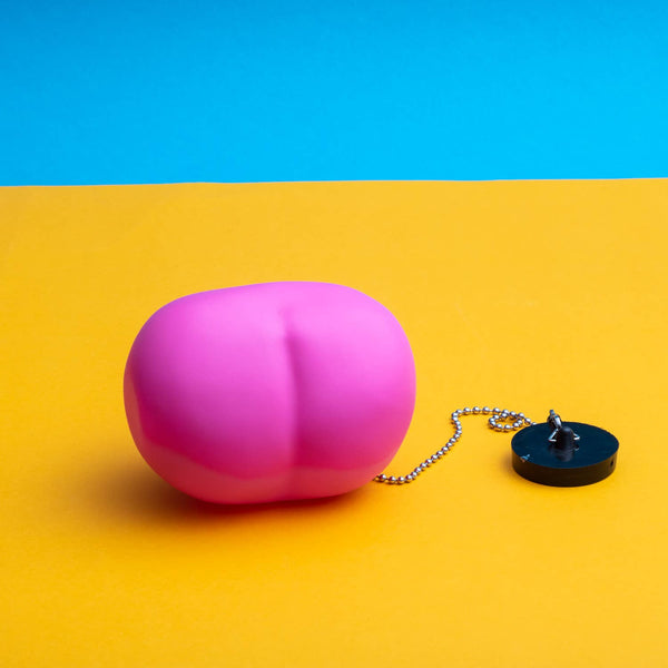 Bouchon de baignoire en forme de fesses