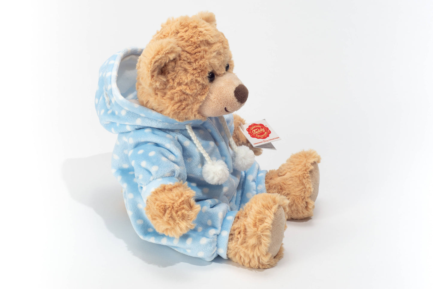 Teddybeer in blauwe pyjama