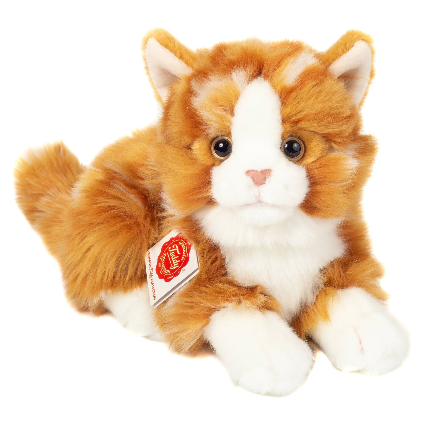 Gato pelirrojo de peluche acostado
