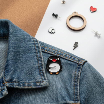 Pingüino con alfiler de cuchillo