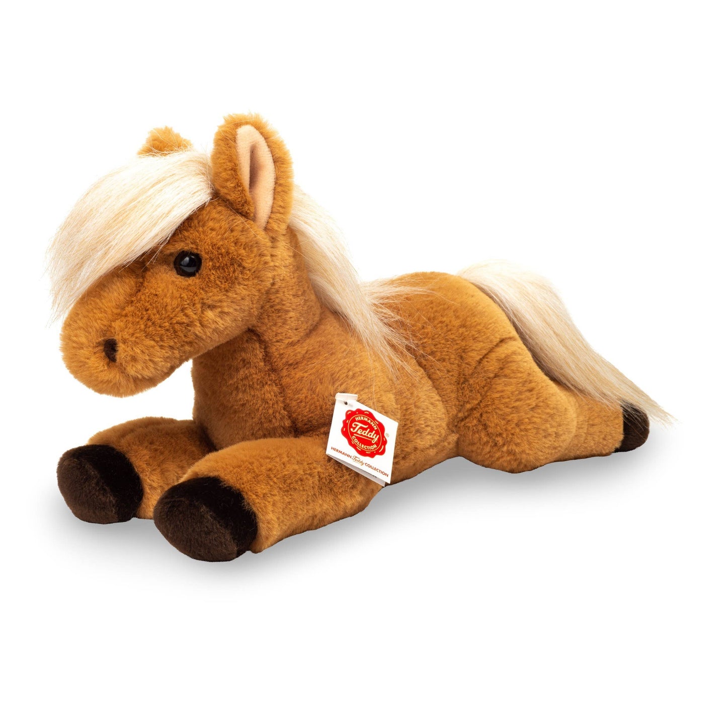 Caballo de peluche tumbado