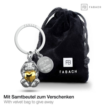 Llavero con forma de conejito grabado con la frase "Te quiero como a ningún otro conejito". Lindo amuleto de la suerte con forma de corazón.