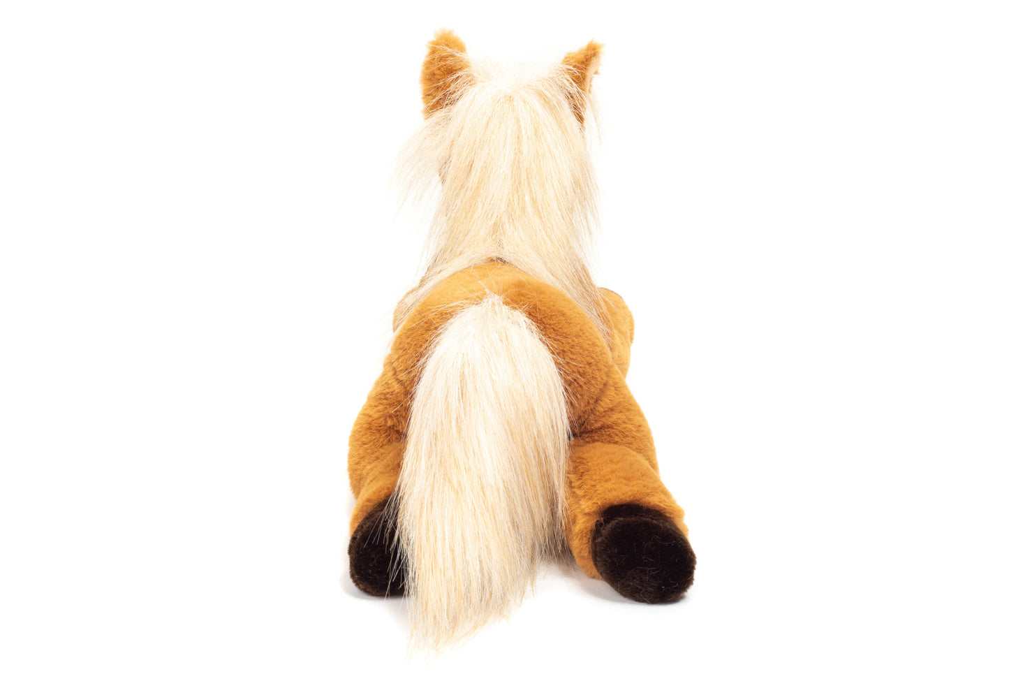 Caballo de peluche tumbado