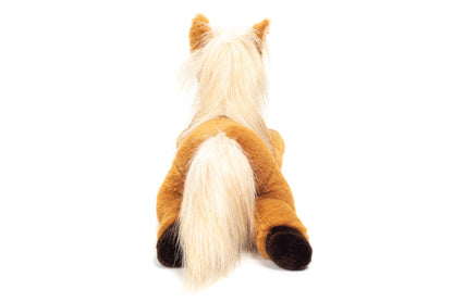 Caballo de peluche tumbado