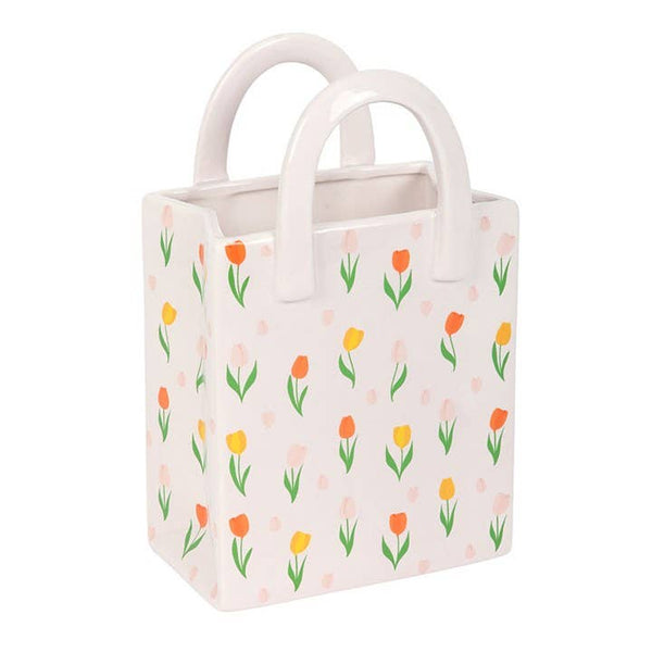 Jarrón de cerámica con forma de bolsa y estampado de tulipanes para flores de primavera.