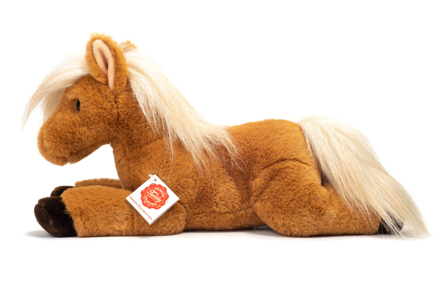 Caballo de peluche tumbado