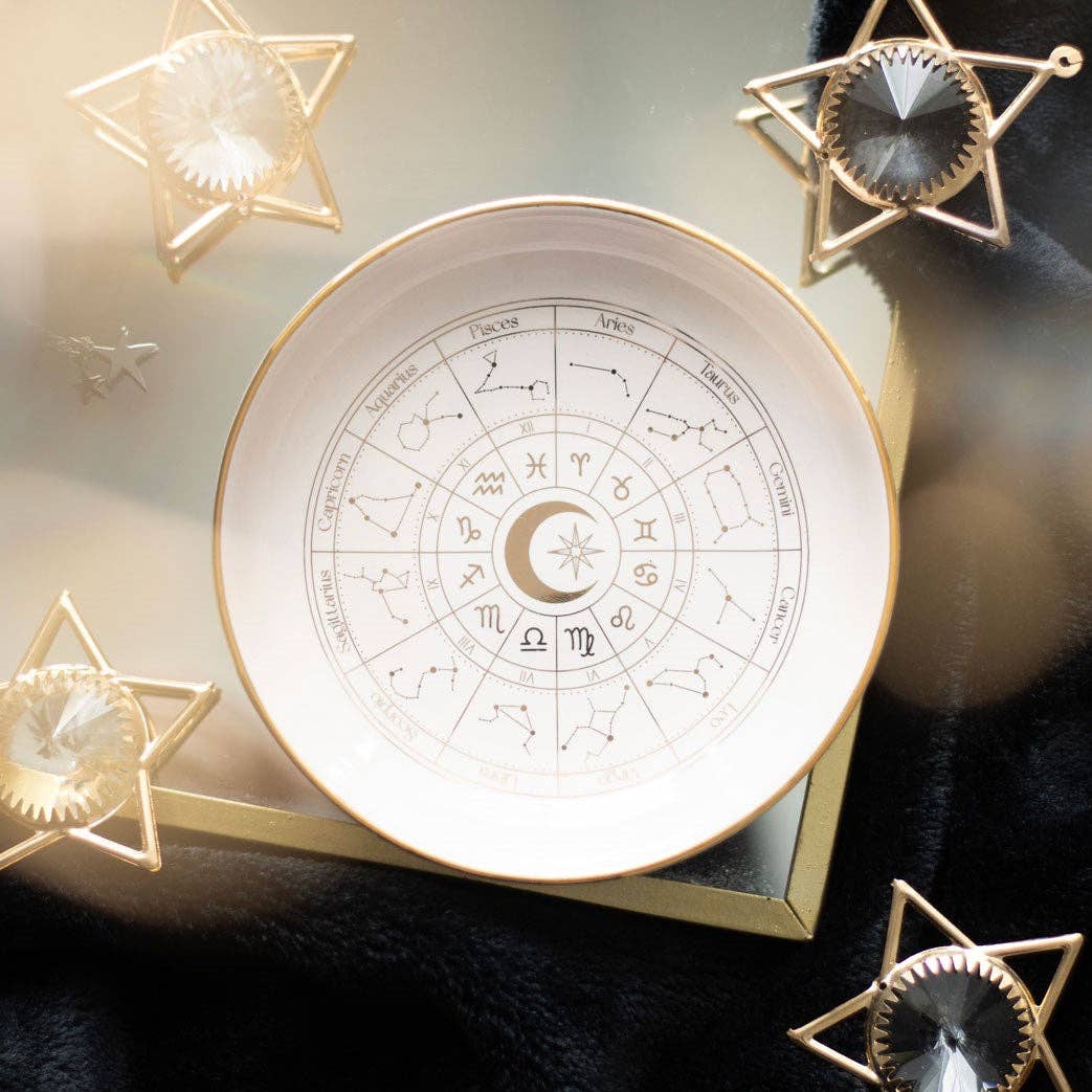 Plat à babioles en forme de roue astrologique blanc cassé