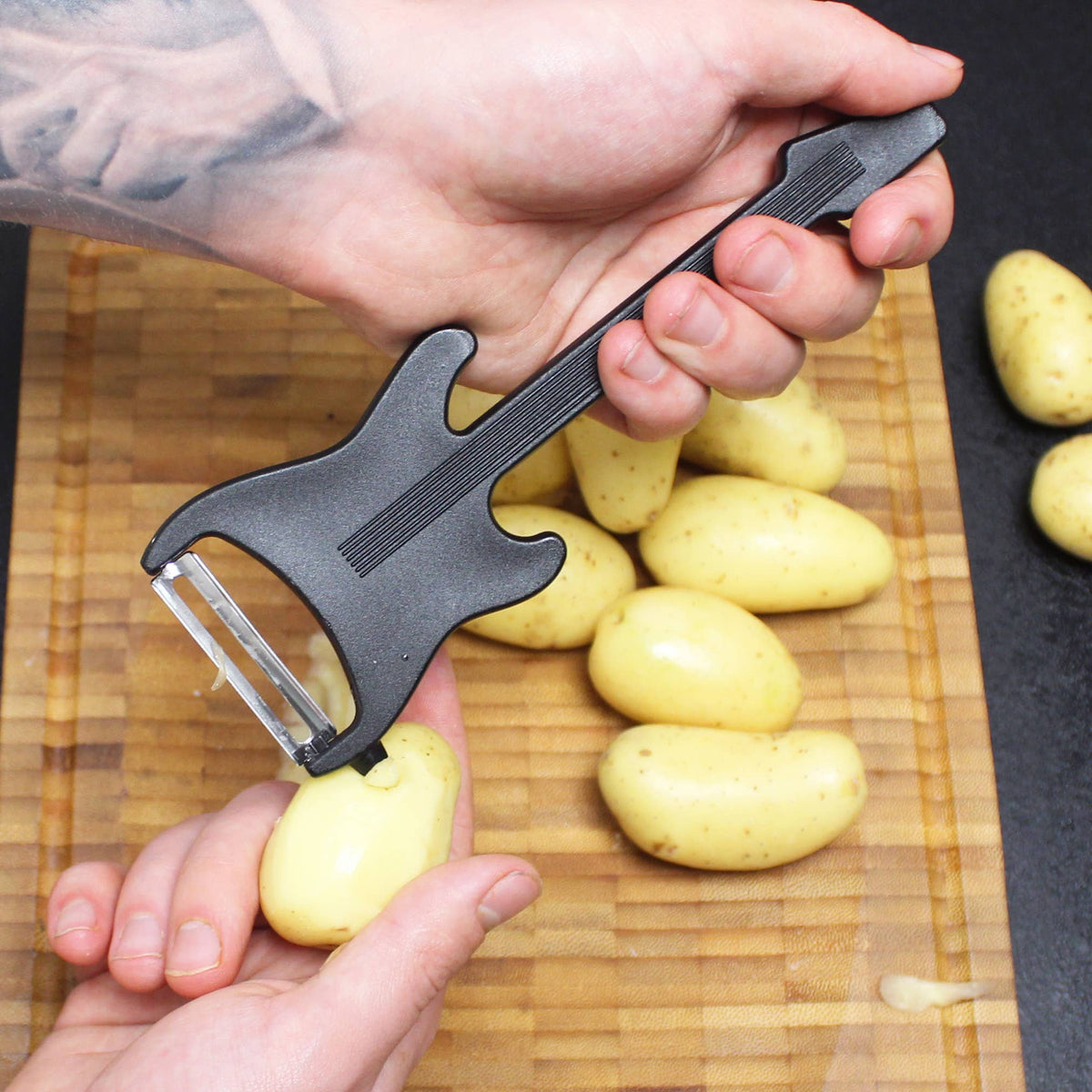 Pelador de verduras de guitarra eléctrica