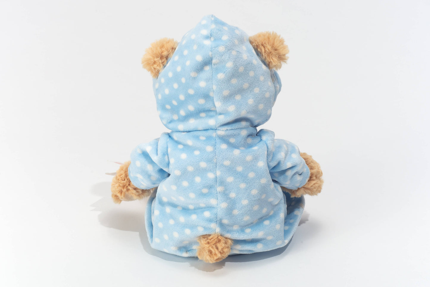 Teddybeer in blauwe pyjama