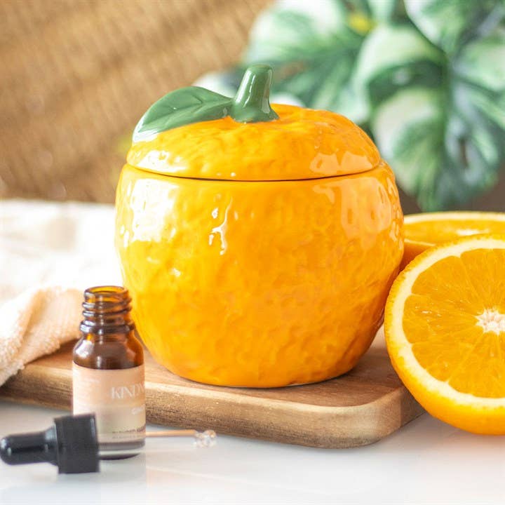 Oil burner shaped like a freshly picked orange