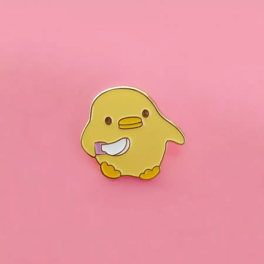 Pin’s Canard Jaune avec Couteau